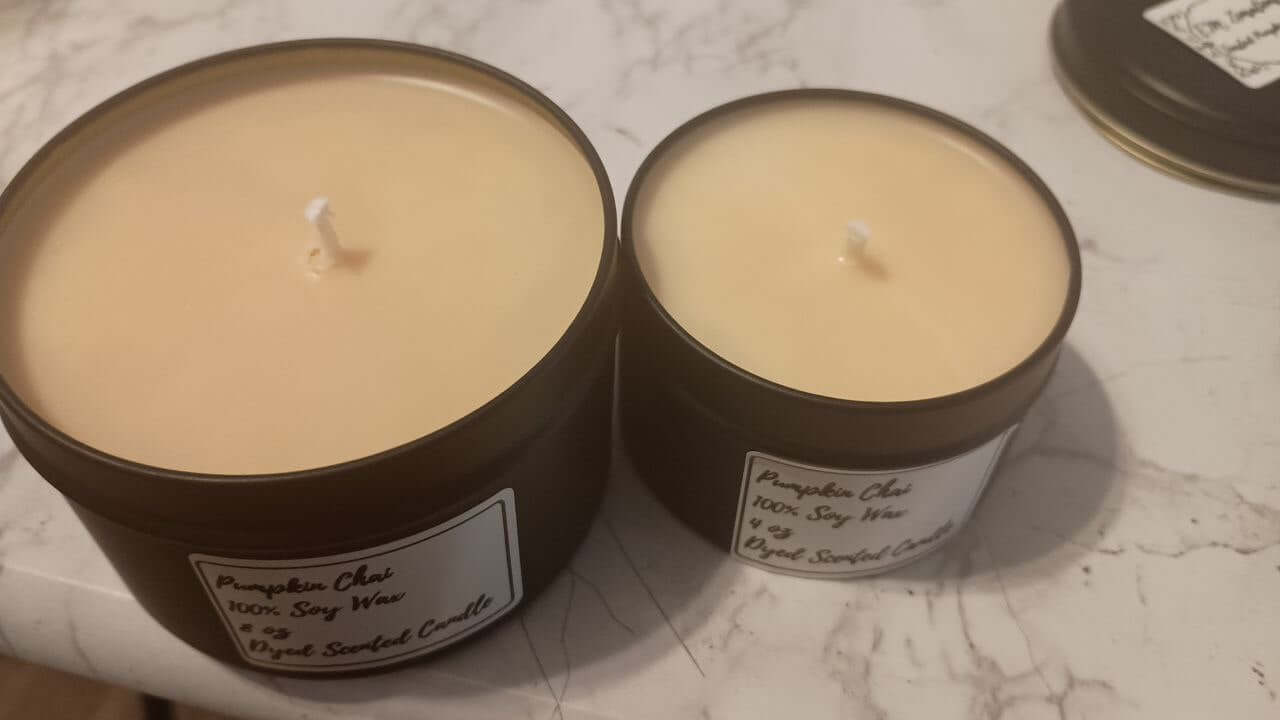 Toasted Pumpkin Chai Candle in two sizes, showcasing a warm spiced autumn glow with creamy pumpkin and spice scents.