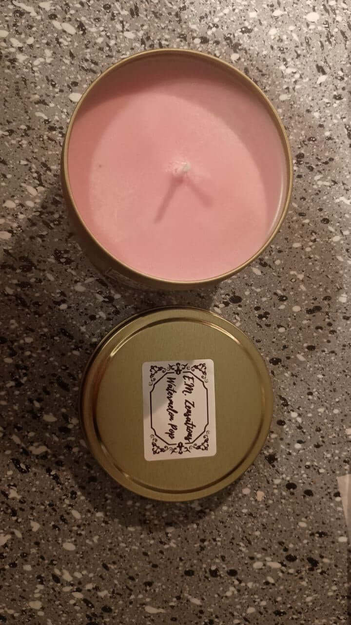 Watermelon Scented Candles in a gold tin with a pink wax interior, perfect for adding a sweet, refreshing aroma to any space.
