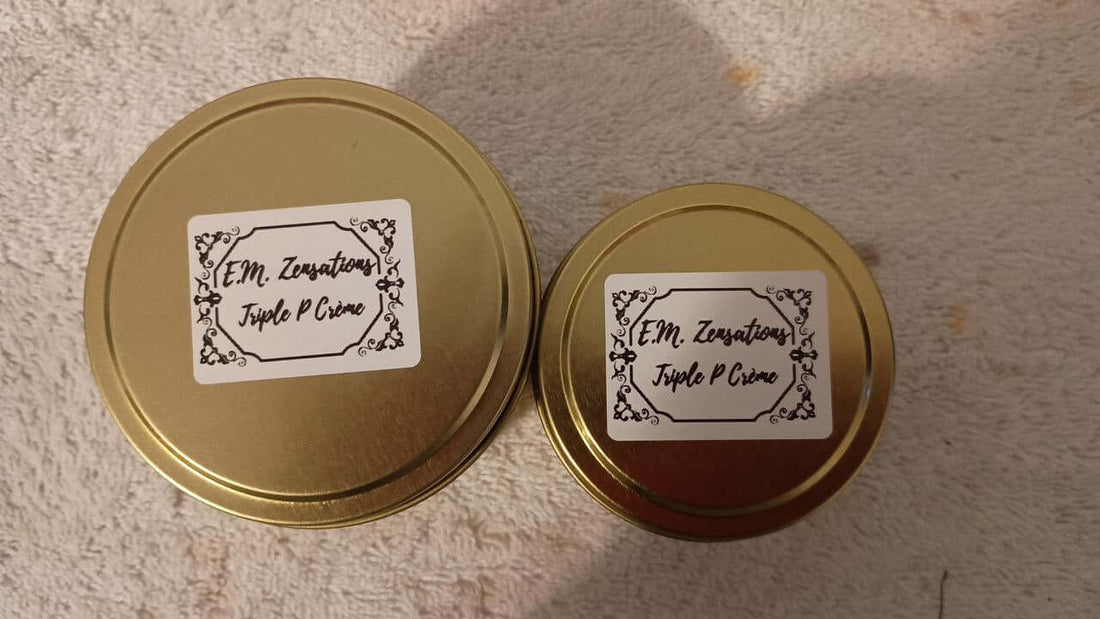 Two sizes of Triple P Creme candle in gold tin containers with elegant labels.