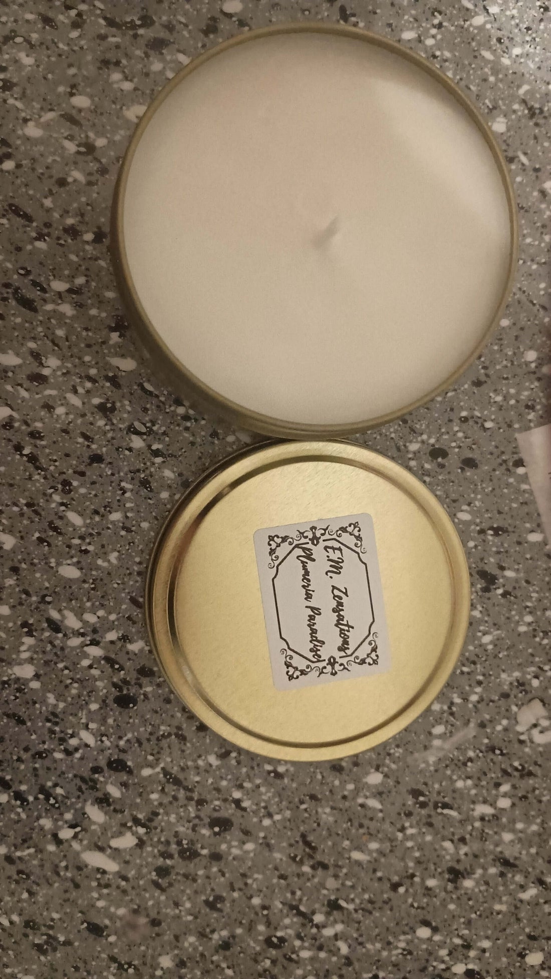 Plumeria Fragrance Scented Candles in a gold tin, showcasing a soft, tropical aroma for a peaceful atmosphere.